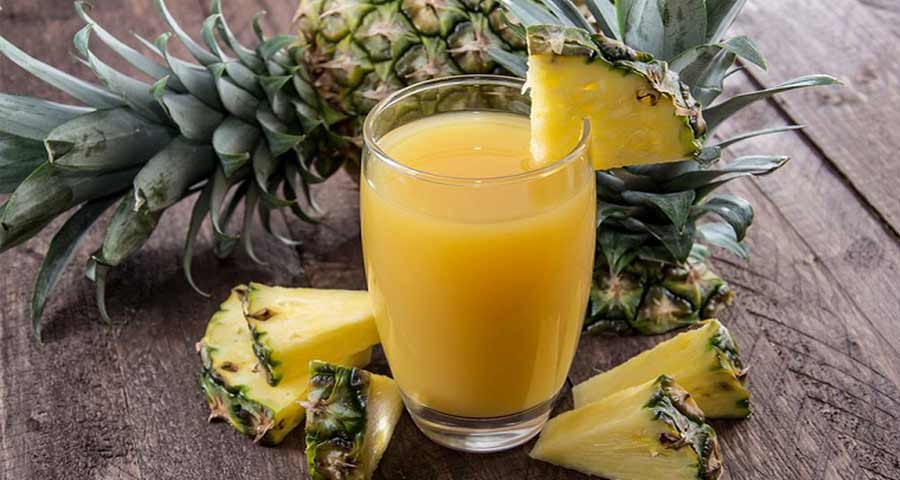 Pineapple and Pineapple Juice on a table
