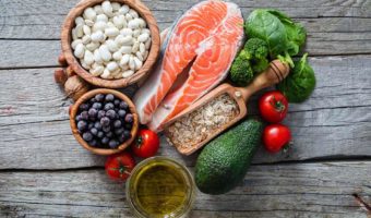 A list of healthy fats for weight loss on a wooden table